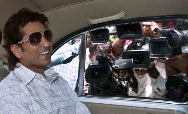 Sachin Tendulkar surrounded by cameramen in Parliament premises - AFP/File photo Sachin Tendulkar surrounded by cameramen in Parliament premises - AFP/File photo